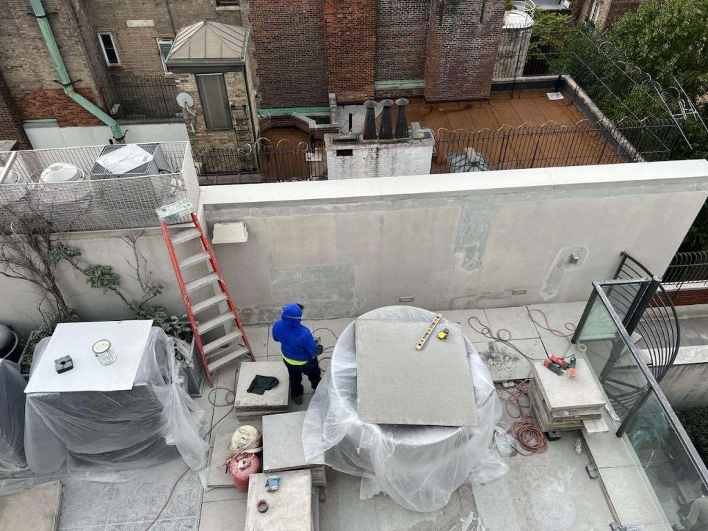 Stucco restoration work in progress at 68th Street NY NY Riedel is expert in masonry work and repair including facade restoration work